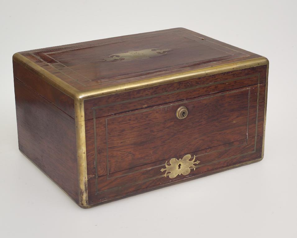 Appraisal: REGENCY ROSEWOOD AND BRASS-BOUND DRESSING CASE the hinged rectangular lid