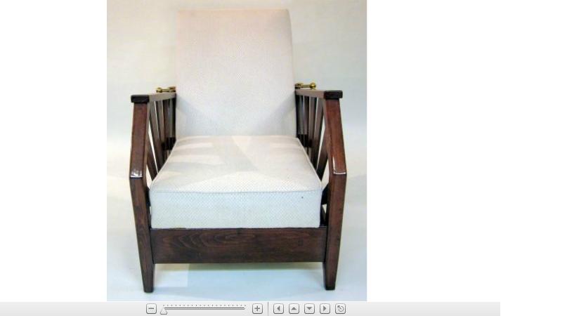 Appraisal: French stained beech reclining armchair The padded free-moving back flanked