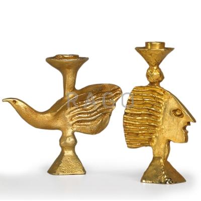 Appraisal: PIERRE CASENOVE FONDICA Two gold-plated metal candlesticks bird and profile