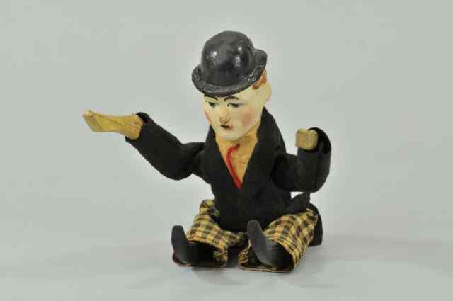 Appraisal: CHARLIE CHAPLIN TUMBLER FIGURE Hand painted composition figure features wooden