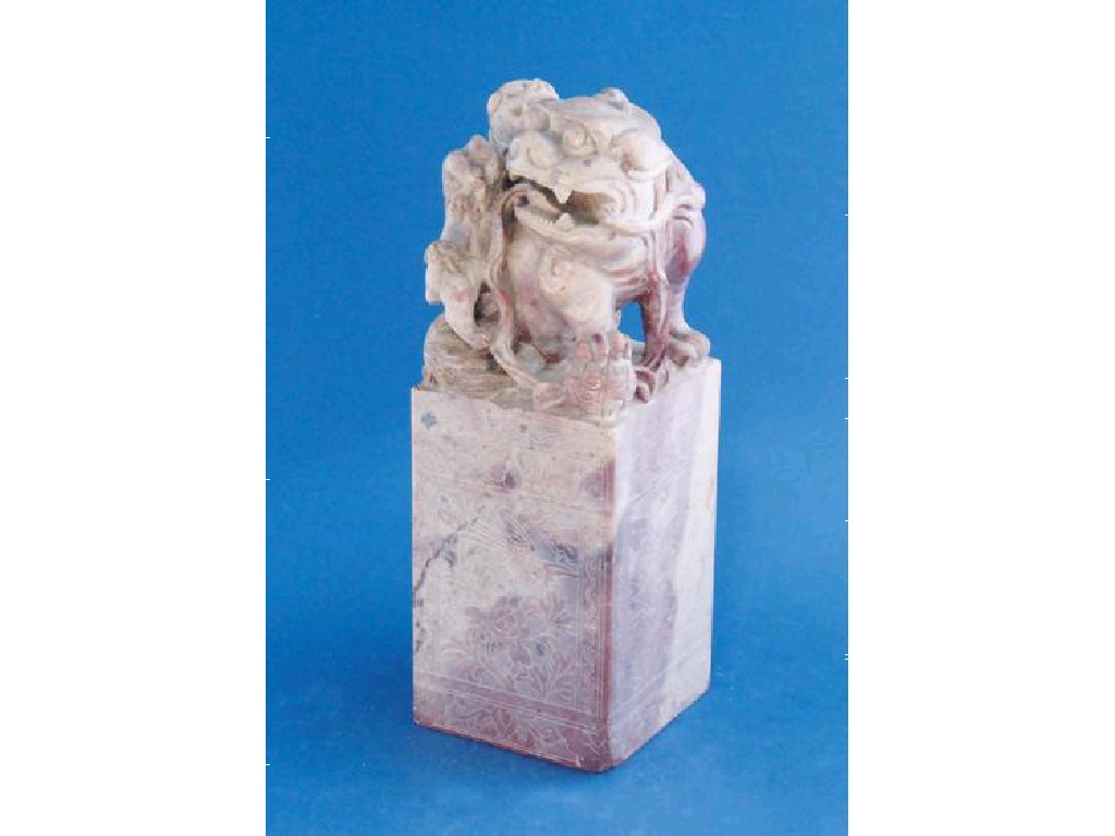 Appraisal: A CHINESE SOAPSTONE SEAL carved with a buddhistic lion and