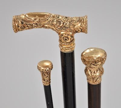 Appraisal: Three Antique Walking Sticks Each with a tooled gold filled