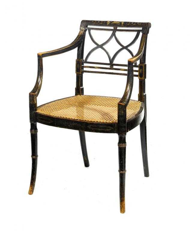 Appraisal: A REGENCY EBONISED AND GILT ELBOW CHAIR the curved rail