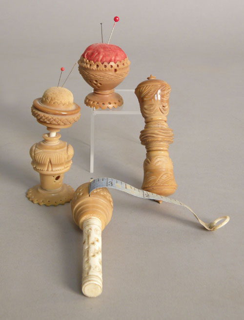 Appraisal: Four vegetable ivory sewing implements th c l