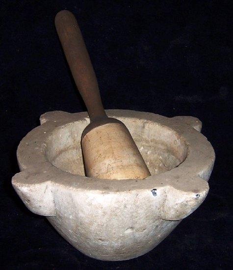 Appraisal: An alabaster mortar cm wide and a pestle with turned