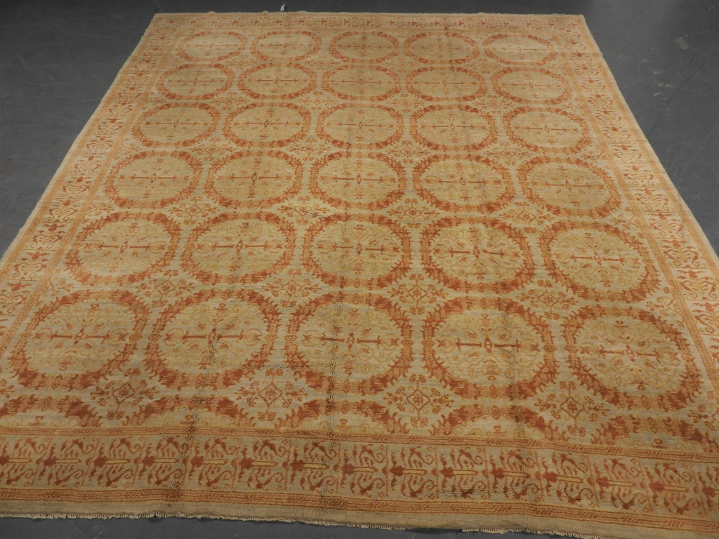 Appraisal: LG SPANISH IVORY RUG Spain Early th CenturyRepeating orange botanical