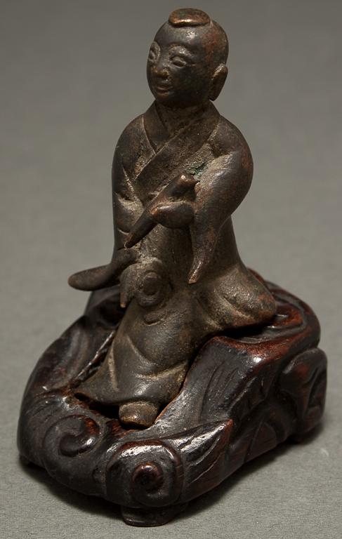 Appraisal: Chinese miniature bronze figure of Kuan-Yin with a carved wooden