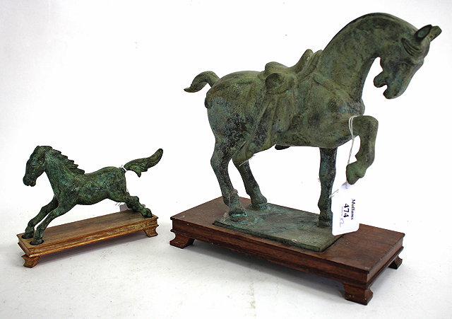 Appraisal: A PATINATED CAST BRONZE SCULPTURE of a prancing horse copy