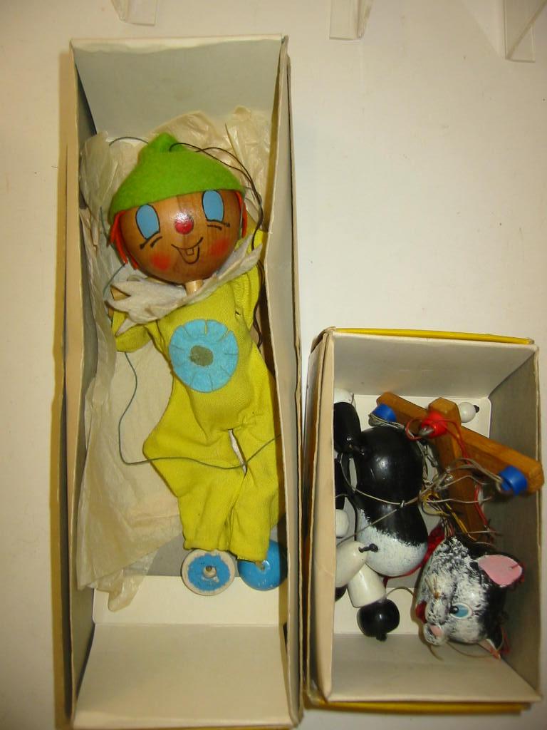 Appraisal: Two Pelham puppets Wooden Head Clown and Cat yellow boxes