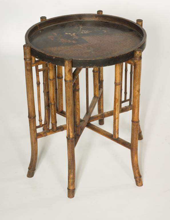 Appraisal: JAPANESE LACQUERED AND BAMBOO TRAY TABLE the circular tray decorated