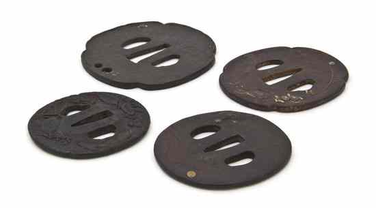 Appraisal: A Group of Four Japanese Iron Tsuba three examples having