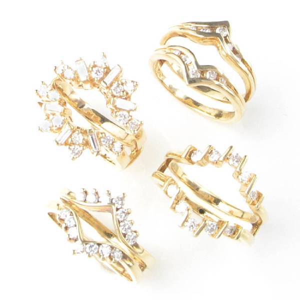 Appraisal: A collection of four diamond and gold ring guards four