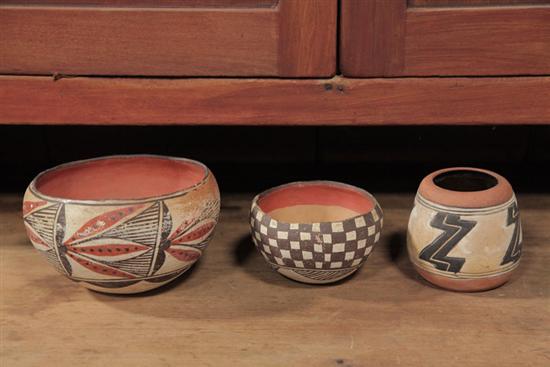 Appraisal: THREE PIECES OF INDIAN POTTERY Clay pottery jars with polychrome