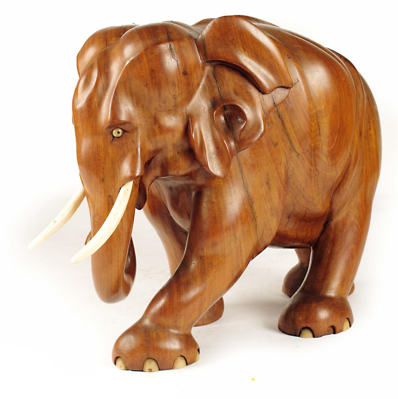 Appraisal: A carved hardwood elephant