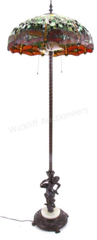 Appraisal: An Art Nouveau style floor lamp footed reticulated cast metal