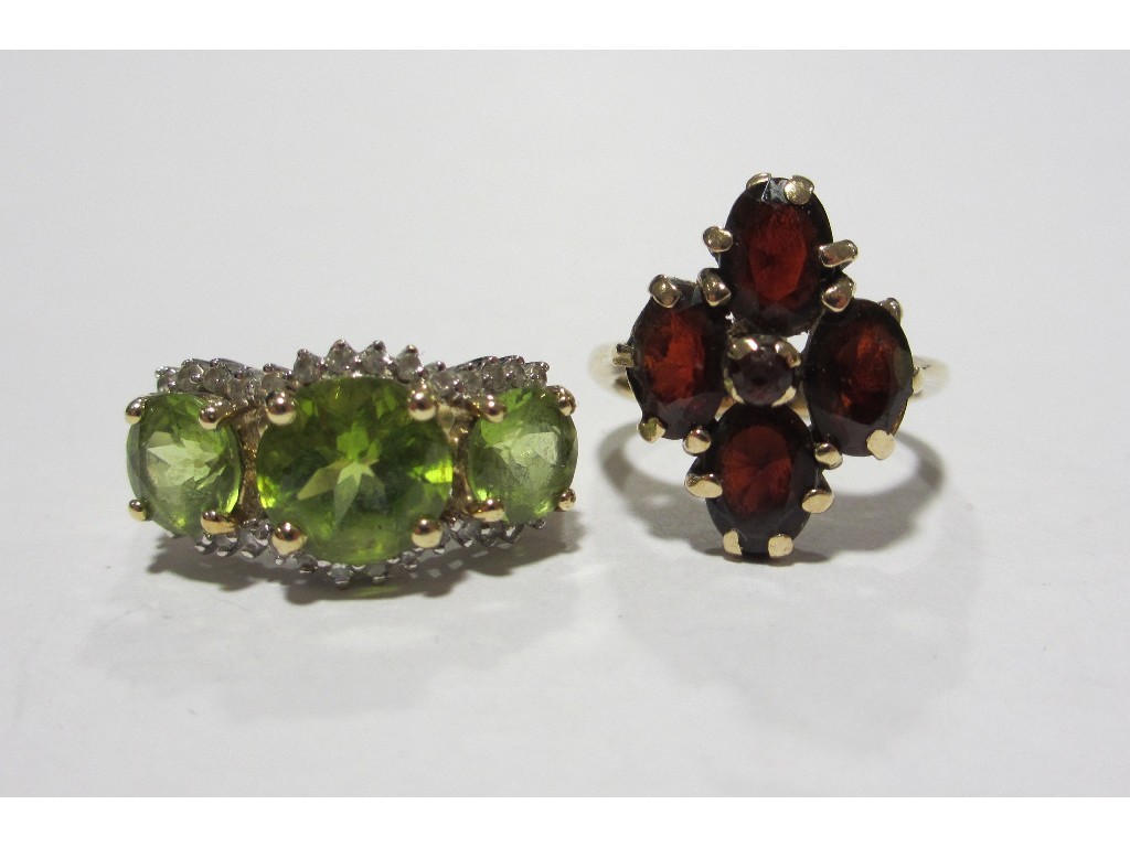 Appraisal: Two ct gold rings to include peridot and diamond triple