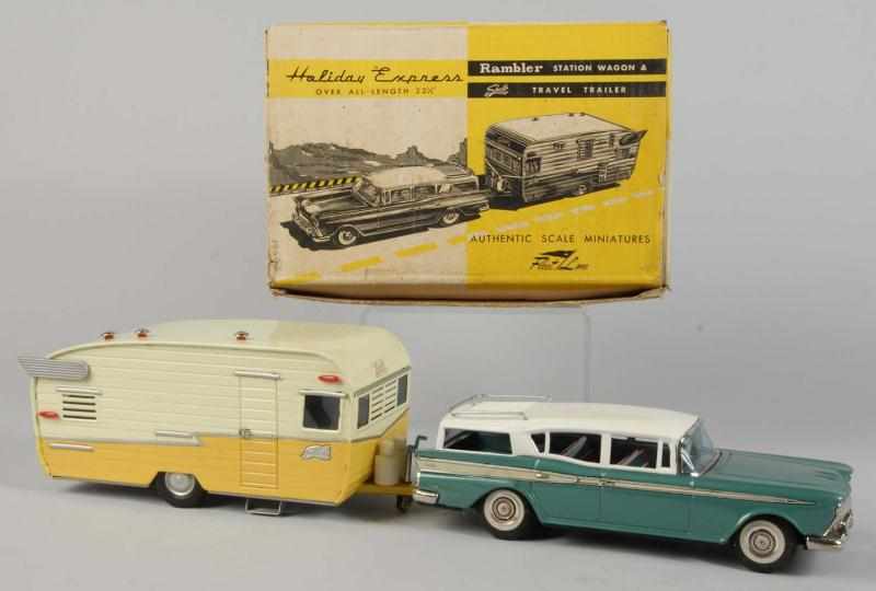 Appraisal: Tin Rambler Station Wagon Trailer Friction Toy Description Japanese Working