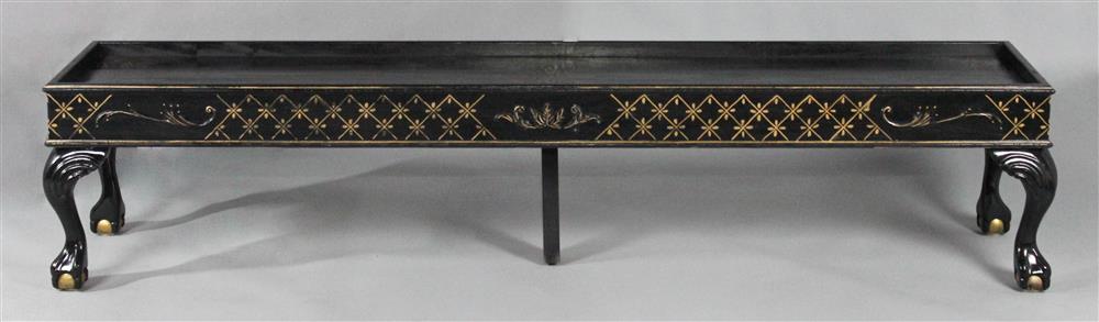 Appraisal: PAINT AND GILT DECORATED CARVED LOW LONG TABLE having a