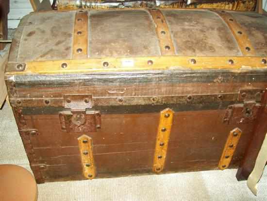 Appraisal: A WOODEN DOMED TOP TRAVELLING TRUNK AND A TIN TRAVELLING