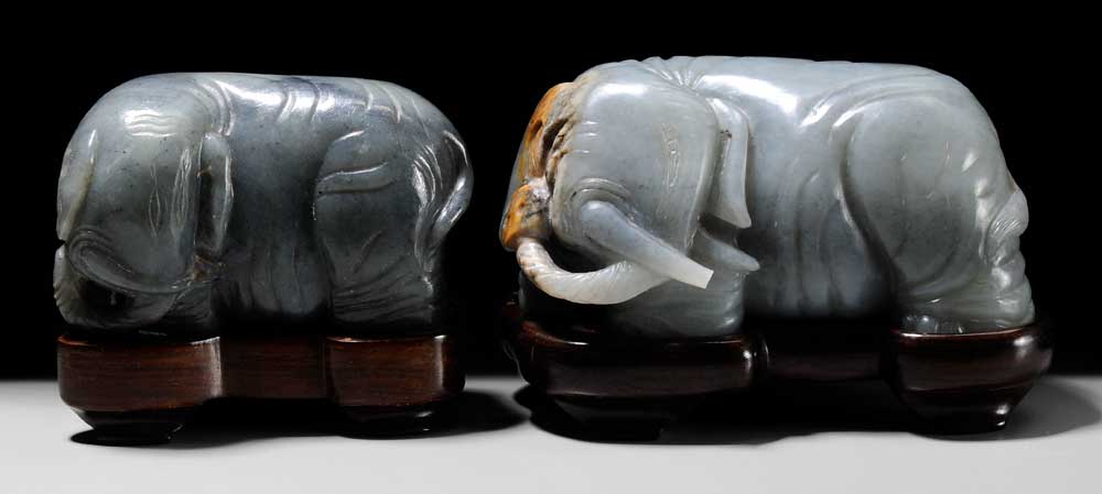 Appraisal: Two Jade Elephants Chinese each carved with heads turned to