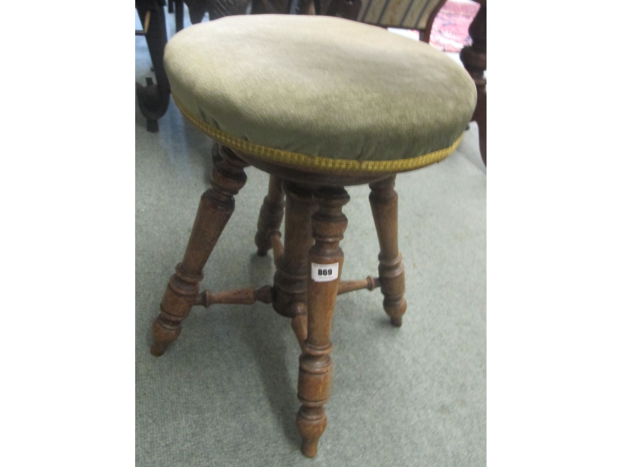 Appraisal: A Victorian beech revolving piano stool