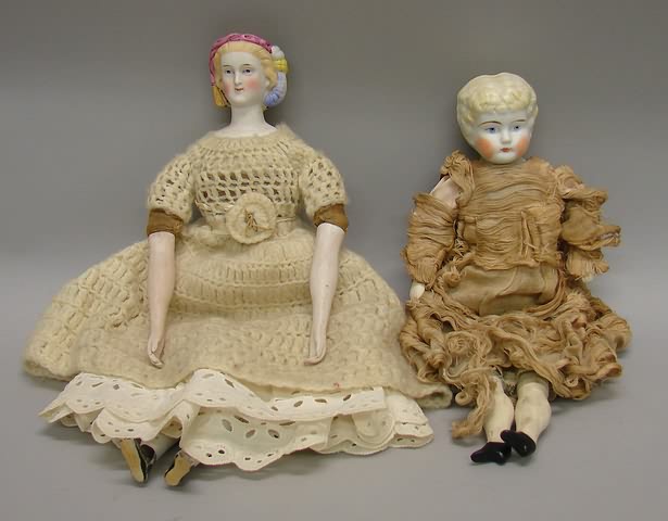 Appraisal: Pair of Parian dolls Unmarked doll with molded black net