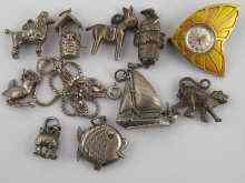 Appraisal: A quantity of white metal tests silver charms approx nine