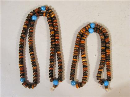 Appraisal: Two strands of carved horn and turquoise beads and two