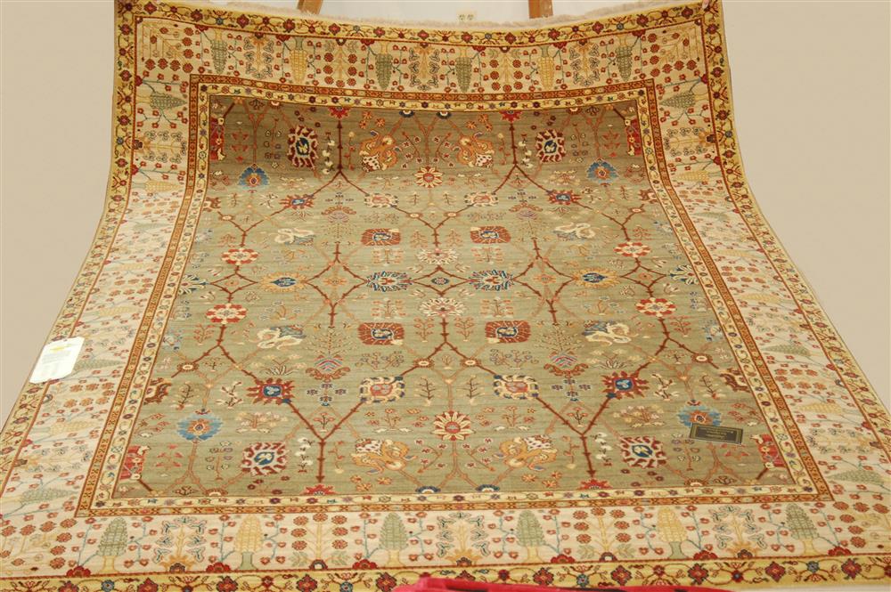 Appraisal: KARASTAN TRADITIONAL WOOL RUG green with ivory and rust approx