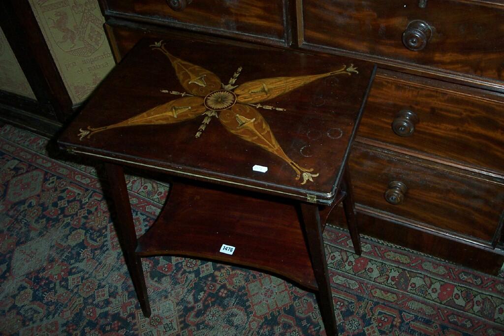 Appraisal: An Edwardian mahogany fold over top card table with marquetry