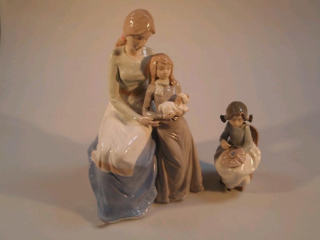 Appraisal: A Continental porcelain figure Lladro style of a mother daughter