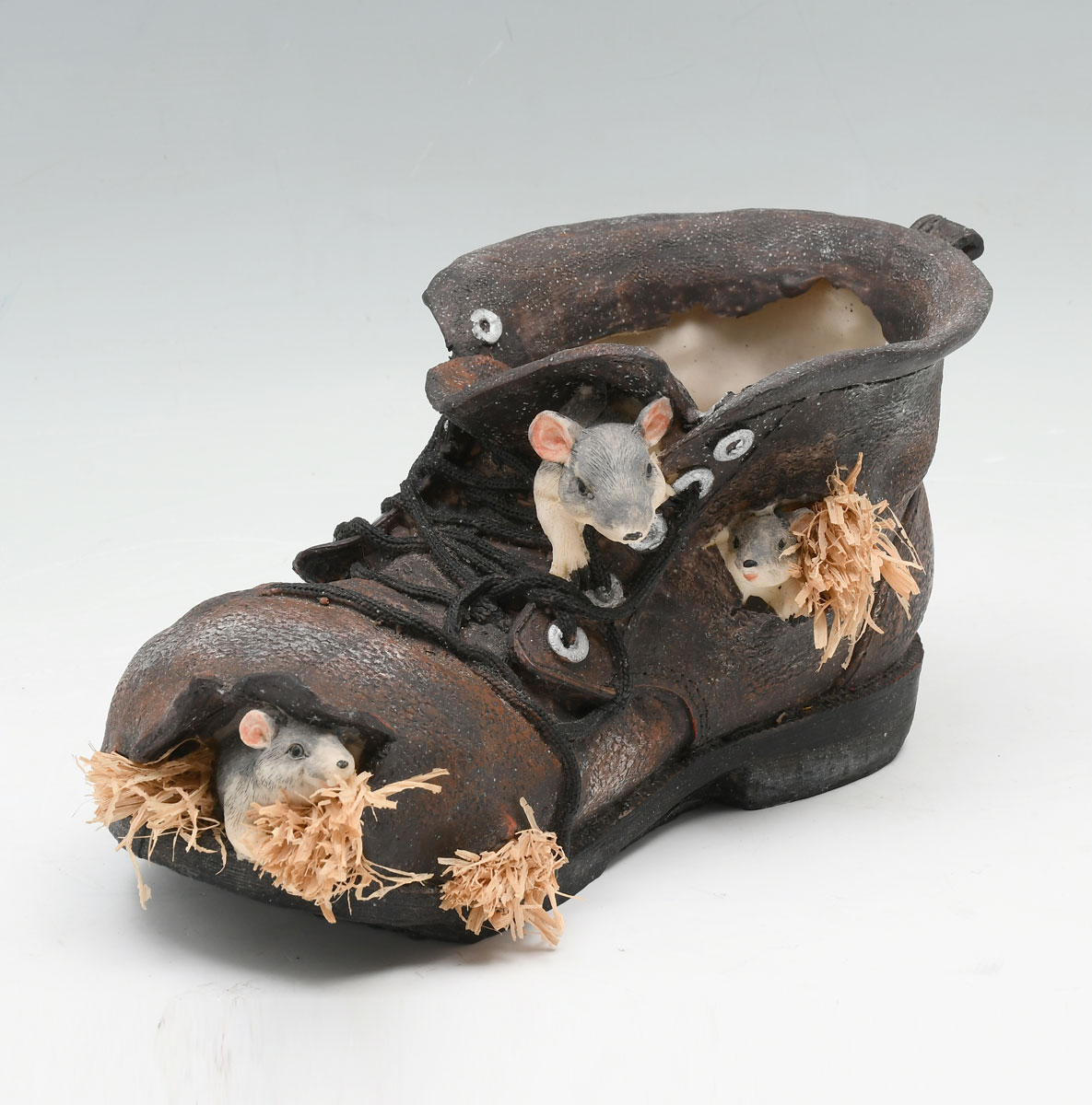 Appraisal: CAST OLD SHOE SCULPTURE WITH MICE IN THE STYLE OF