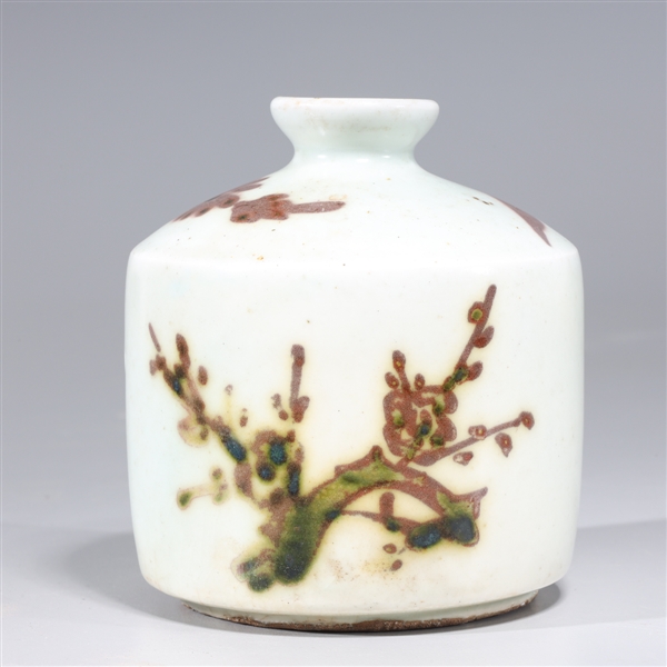 Appraisal: Korean red and white glazed ceramic cosmetic jar with floral