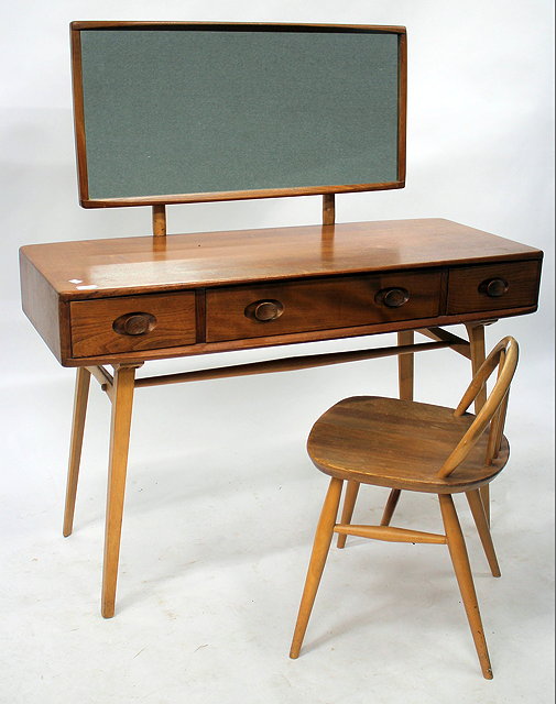 Appraisal: AN ERCOL LIGHT ELM MIRROR BACKED DRESSING TABLE with three