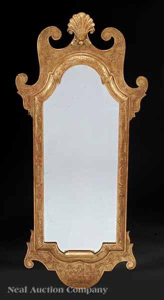 Appraisal: An Antique Continental Rococo Style Carved and Gilded Mirror the