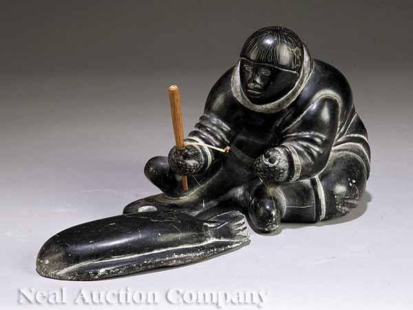 Appraisal: An Alaskan Inuit Soapstone Carving of a Hunter with Seal