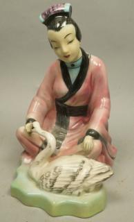 Appraisal: GOLDSCHEIDER Fine China Polychrome Figure Seated Asian woman with swan