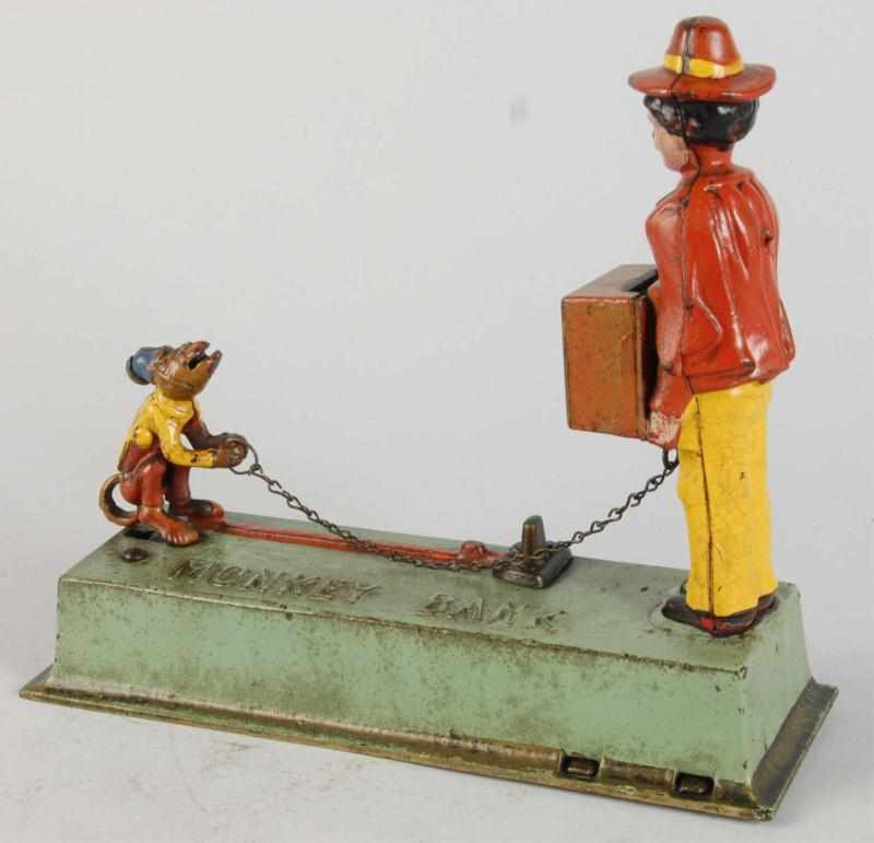 Appraisal: Cast Iron Monkey Mechanical Bank Description Manufactured by Hubley Working