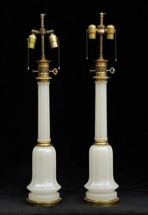 Appraisal: PAIR OF GILT-METAL-MOUNTED OPALINE GLASS OIL LAMPS Each octagonal column