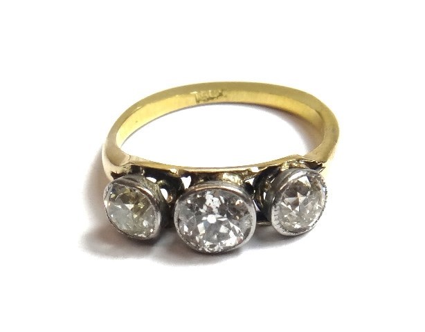 Appraisal: A gold and diamond set three stone ring collet set