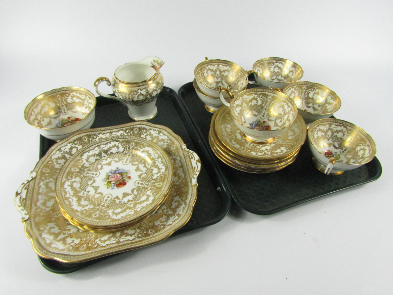 Appraisal: An Aynsley porcelain part tea service decorated with a floral