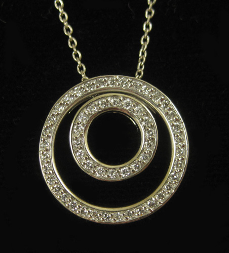 Appraisal: DIAMOND AND FOURTEEN KARAT GOLD PENDANT NECKLACE suspended on a