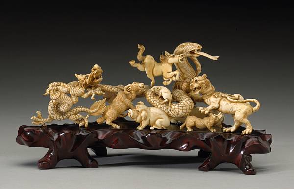 Appraisal: A carved and pieced ivory zodiac group Depicting the twelve