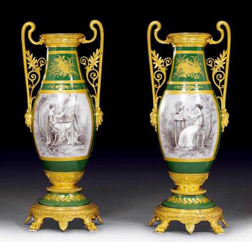 Appraisal: PAIR OF GILT BRONZE AND PORCELAIN ORNAMENTAL VASES Restauration France