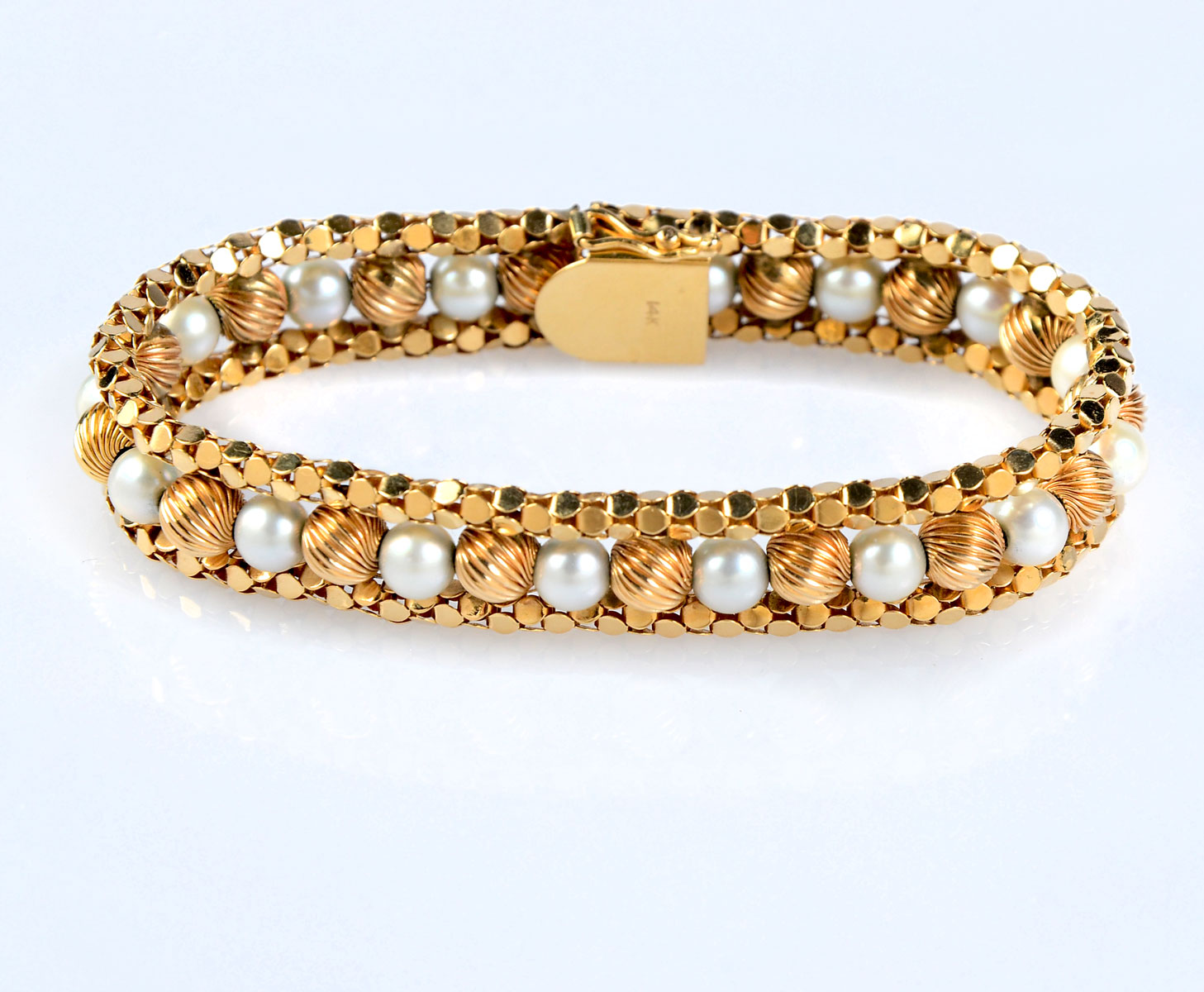 Appraisal: K GOLD PEARL BEAD BRACELET uniquely designed ridges of K