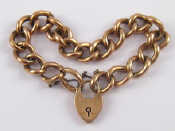 Appraisal: A carat gold curb link bracelet with padlock clasp approx