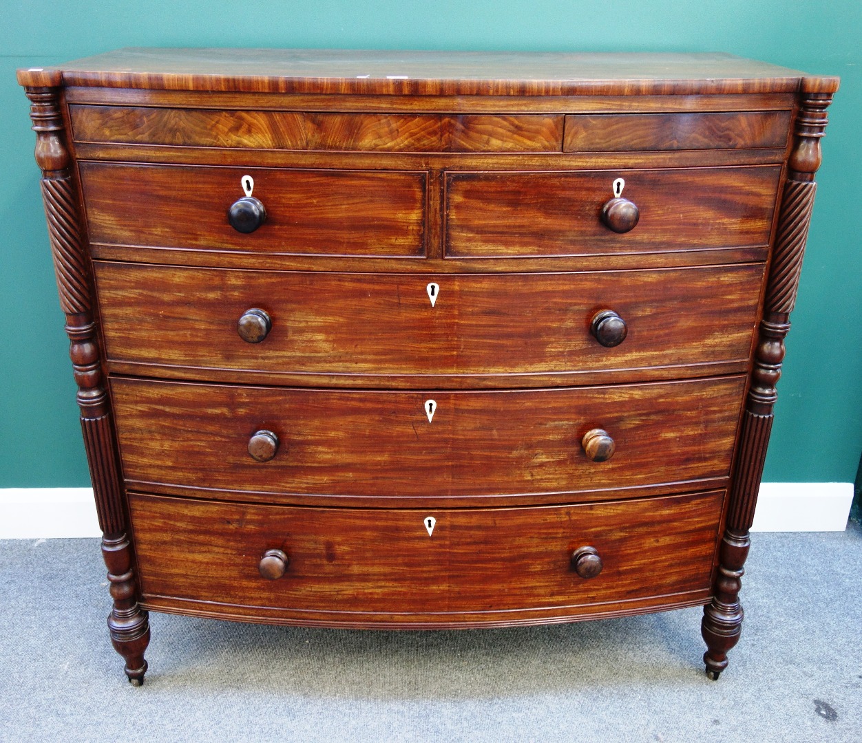 Appraisal: A large George IV mahogany bowfront chest of two short