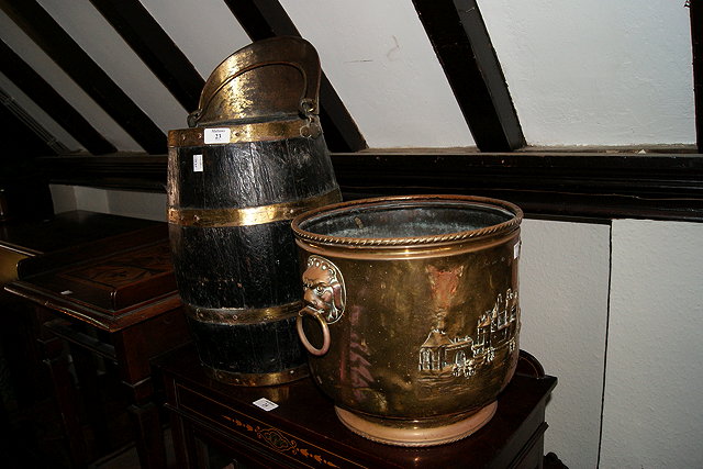 Appraisal: AN OAK AND BRASS BOUND FIRE BUCKET in the form