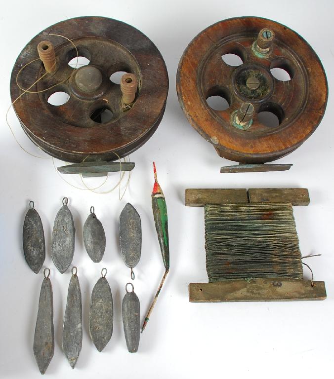 Appraisal: TWO LARGE WOODEN FISHING REELS AND VARIOUS CASTING WEIGHTS