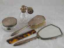 Appraisal: A five piece silver mounted dressing table set comprising brush